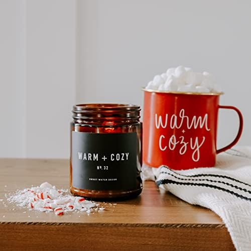 Sweet Water Decor Warm and Cozy Candle | Pine, Orange, Cinnamon, and Fir Balsam Winter Scented Soy Candles for Home | 9oz Amber Jar with Black Lid, 40 Hour Burn Time, Made in The USA