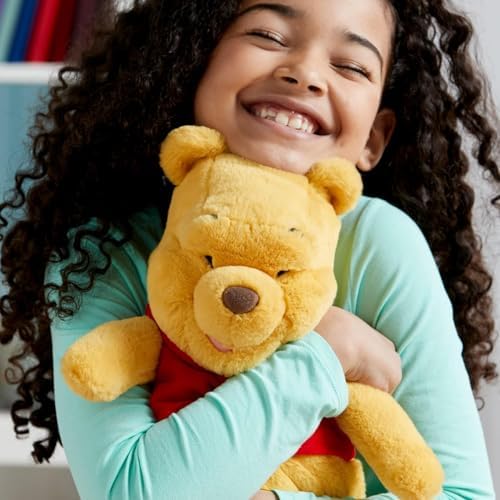 DISNEY STORE Official Pooh Medium Soft Toy for Kids, Cuddly Character with Fuzzy Texture and Embroidered Details, Red T-Shirt, Disney Plushy Suitable for All Ages.